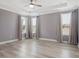 Spacious main bedroom with a tray ceiling, ceiling fan, and ample natural light at 7266 Desert Mandarin St, Winter Garden, FL 34787