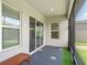 Covered porch with decorative stone and a bench offers relaxing outdoor living space at 7266 Desert Mandarin St, Winter Garden, FL 34787