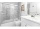 Clean bathroom with a marble-look shower and white vanity at 840 Center Ave # 80, Daytona Beach, FL 32117