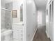 Updated bathroom with marble-look shower and white vanity at 840 Center Ave # 80, Daytona Beach, FL 32117