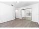 Bedroom with wood-look floors and mirrored closet doors at 840 Center Ave # 80, Daytona Beach, FL 32117