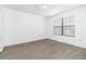 This bedroom has new flooring and a large window at 840 Center Ave # 80, Daytona Beach, FL 32117