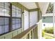 Condo with charming green exterior and two front doors at 840 Center Ave # 80, Daytona Beach, FL 32117