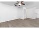 Open living room featuring luxury vinyl plank flooring, a closet, and a ceiling fan at 840 Center Ave # 80, Daytona Beach, FL 32117