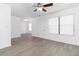 Open living room featuring luxury vinyl plank flooring, ceiling fan, and plenty of natural light at 840 Center Ave # 80, Daytona Beach, FL 32117