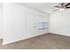 A bright living room featuring luxury vinyl plank flooring, ceiling fan, and blinds on the windows at 840 Center Ave # 80, Daytona Beach, FL 32117