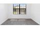 Bright room featuring wood-look flooring and a large window for natural light at 840 Center Ave # 80, Daytona Beach, FL 32117