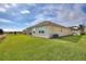Charming home featuring a well-maintained lawn and tile roof at 8990 Ace Loop, Champions Gate, FL 33896