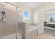 Bathroom featuring shower, soaking tub, and window, adjacent to bedroom at 8990 Ace Loop, Champions Gate, FL 33896