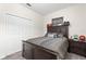 Comfortable bedroom with dark wood furniture and a large window for natural light, lots of storage space at 8990 Ace Loop, Champions Gate, FL 33896