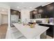 Island kitchen featuring stainless steel appliances, and a breakfast bar with modern seating at 8990 Ace Loop, Champions Gate, FL 33896