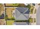 Aerial view showcases the roof, backyard, and the home's position in the neighborhood at 11603 Malverns Loop, Orlando, FL 32832