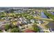 Aerial view of a neighborhood with ponds and manicured lawns at 11603 Malverns Loop, Orlando, FL 32832