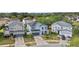 Aerial view of a lovely two-story home with a well-manicured lawn in a residential neighborhood at 11603 Malverns Loop, Orlando, FL 32832