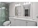 Bright bathroom with double sink vanity, a modern shower, and great fixtures at 11603 Malverns Loop, Orlando, FL 32832