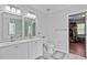 Bright bathroom with double sink vanity, a modern shower, and access to a closet at 11603 Malverns Loop, Orlando, FL 32832