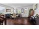Inviting living room with hardwood floors, comfortable seating, and an abundance of natural light at 11603 Malverns Loop, Orlando, FL 32832