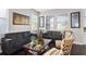 Bright and airy living room with comfortable seating, large windows, and stylish decor at 11603 Malverns Loop, Orlando, FL 32832