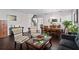 Spacious open-concept living area seamlessly connects the living room, dining room, and staircase at 11603 Malverns Loop, Orlando, FL 32832
