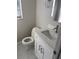 Bathroom featuring a white vanity with granite countertop and a matching toilet at 124 Cinnamon Dr, Orlando, FL 32825