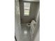 Bathroom with marble tile flooring, white vanity with sink, toilet and window for natural lighting at 124 Cinnamon Dr, Orlando, FL 32825