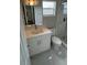 Bathroom featuring modern vanity, updated fixtures, and shower with decorative marble tile at 124 Cinnamon Dr, Orlando, FL 32825