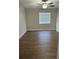 Bedroom featuring wood-look flooring and a ceiling fan at 124 Cinnamon Dr, Orlando, FL 32825