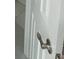 Close-up of a white interior door with a modern brushed nickel handle and a classic design at 124 Cinnamon Dr, Orlando, FL 32825