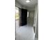 Inviting entryway featuring modern tile flooring, front door with glass side panel, and coat rack with bench at 124 Cinnamon Dr, Orlando, FL 32825