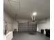 Empty garage with modern garage door and a ceiling-mounted opener system at 124 Cinnamon Dr, Orlando, FL 32825