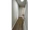 Hallway featuring hardwood floors and neutral-colored walls at 124 Cinnamon Dr, Orlando, FL 32825