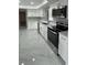 Updated kitchen with stainless steel oven, microwave, and ample counter space at 124 Cinnamon Dr, Orlando, FL 32825