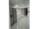 Kitchen features an island with a quartz countertop, new appliances, and white cabinets at 124 Cinnamon Dr, Orlando, FL 32825