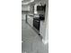 Updated kitchen with stainless steel oven, microwave, and ample counter space at 124 Cinnamon Dr, Orlando, FL 32825