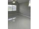 Bright living room with large windows offering ample natural light and tiled floors adding modern touch at 124 Cinnamon Dr, Orlando, FL 32825
