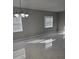 Bright living room featuring marble tile floors, neutral paint, and modern lighting at 124 Cinnamon Dr, Orlando, FL 32825