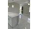 Stylish living room featuring modern lighting, white countertop bar area, and tile floors offering a modern touch at 124 Cinnamon Dr, Orlando, FL 32825