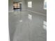 Spacious living room showcasing the white marble floors, modern windows, and neutral wall paint at 124 Cinnamon Dr, Orlando, FL 32825