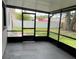 The screened-in patio offers an outdoor space with views of the well maintained backyard at 124 Cinnamon Dr, Orlando, FL 32825