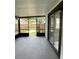 Enclosed patio area offering an outdoor space with backyard views and access to the indoors at 124 Cinnamon Dr, Orlando, FL 32825