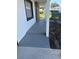 A covered gray walkway and white column on a freshly painted home at 124 Cinnamon Dr, Orlando, FL 32825