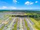 A panoramic view of a Primary-planned community featuring contemporary homes and lush green spaces at 1538 Mermaid Way, Haines City, FL 33844