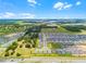 A scenic aerial perspective of a new community, blending residential living with natural landscapes at 1538 Mermaid Way, Haines City, FL 33844