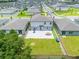 Aerial view showcases the backyard of the home with a patio and green lawn for outdoor activities at 1538 Mermaid Way, Haines City, FL 33844