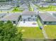 Aerial view showcases the backyard of the home with a patio and green lawn for outdoor activities at 1538 Mermaid Way, Haines City, FL 33844