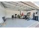 Spacious garage with epoxy floor, providing ample parking and storage space at 1538 Mermaid Way, Haines City, FL 33844