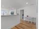 Upstairs hallway with white walls, wood floors and a small desk at 1538 Mermaid Way, Haines City, FL 33844