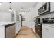 Bright kitchen with a stainless dishwasher and appliances and white countertops at 1538 Mermaid Way, Haines City, FL 33844