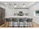 Charming kitchen featuring stainless appliances, center island and modern lighting at 1538 Mermaid Way, Haines City, FL 33844