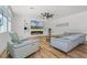 Comfortable living room with a sleek fireplace, ceiling fan, and stylish furnishings at 1538 Mermaid Way, Haines City, FL 33844